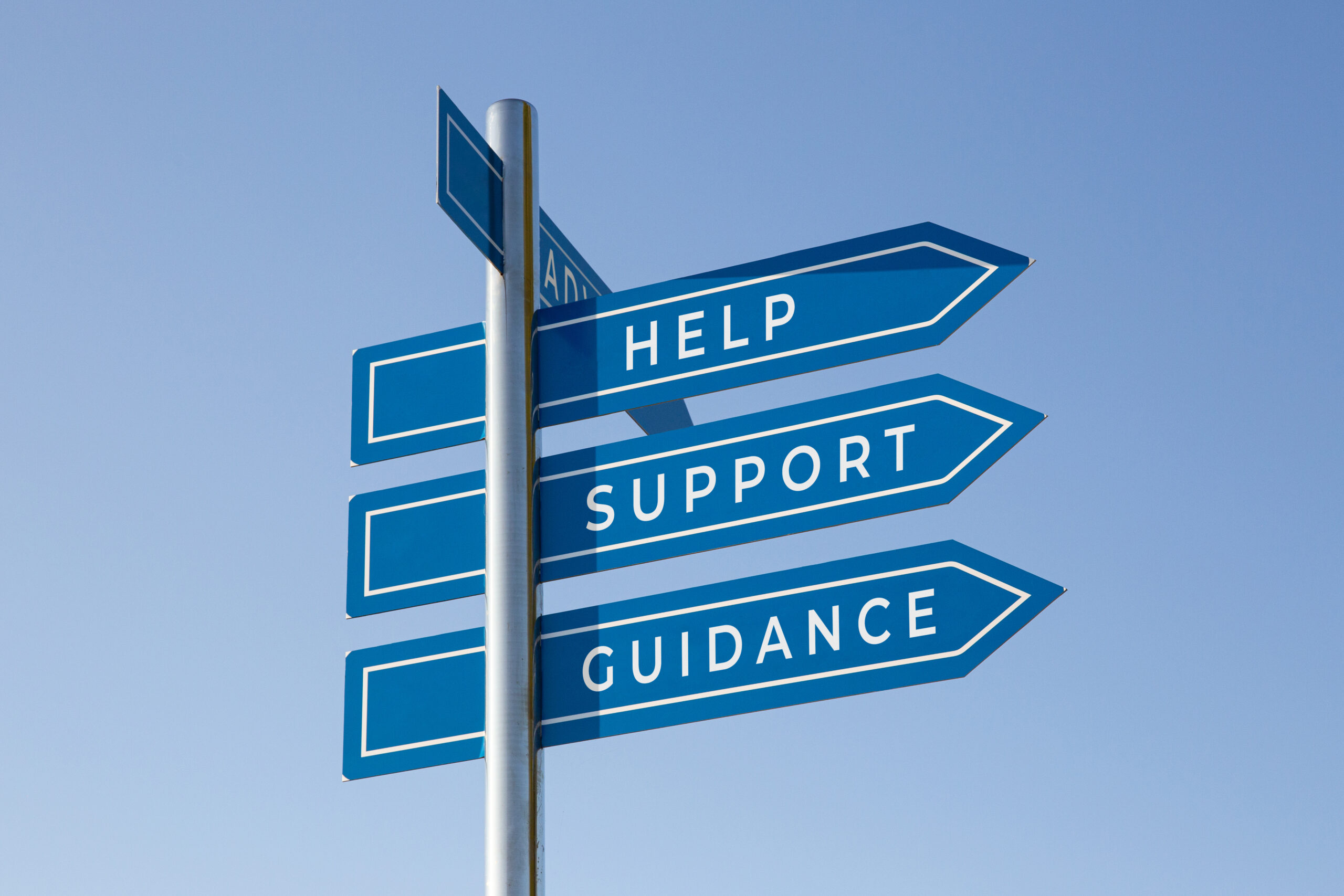 Blue sign post showing directions to support, guidance and help